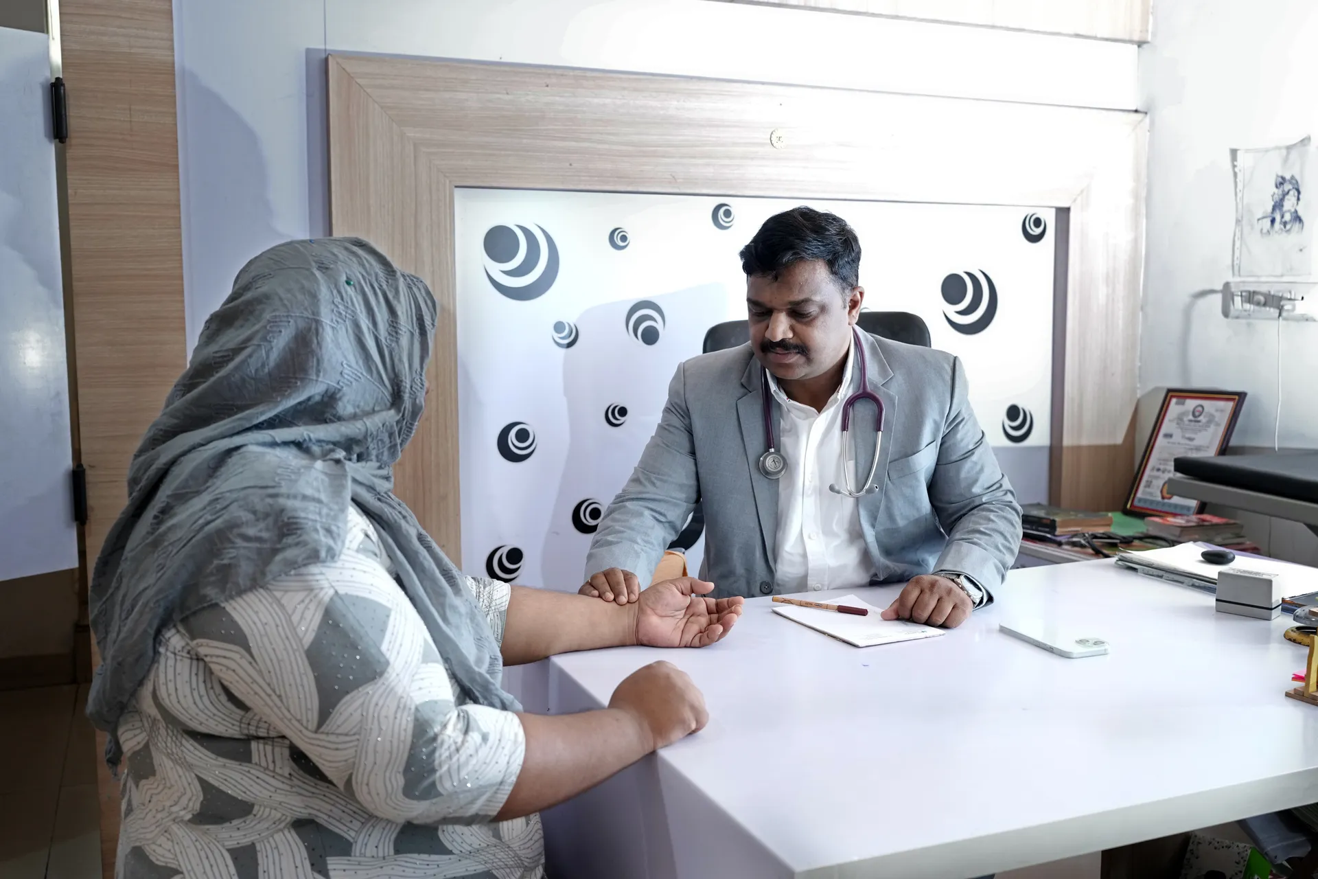 An Ayurvedic physician consulting with a patient at Sanyu Ayurveda